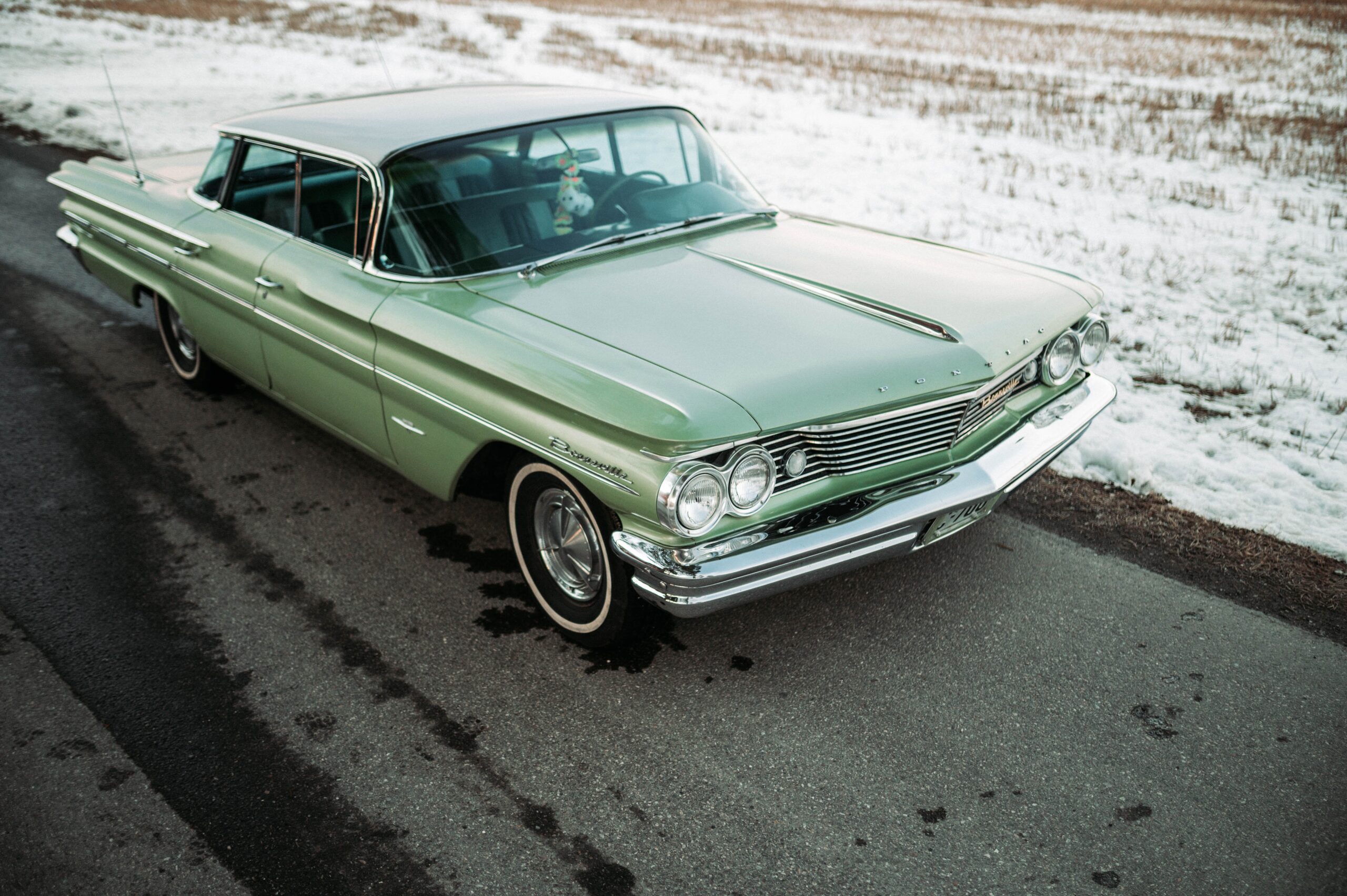 white classic car on road during daytime