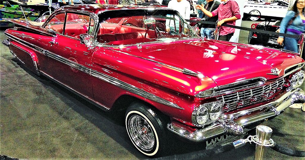 Bright red, '59 Chevy Impala lowrider with shimmering chrome