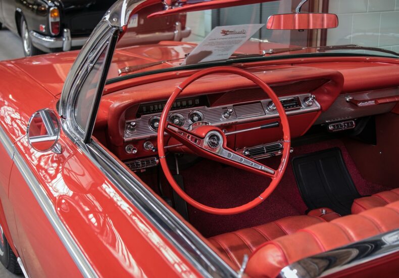 Red classic Chevy Impala convertible/cabriolet with the top down