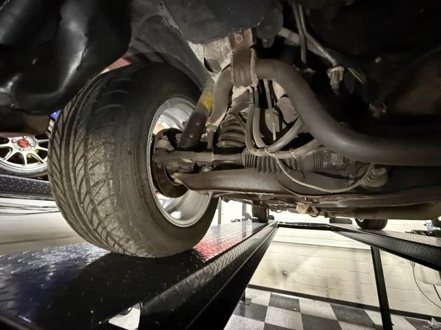 The undercarriage of a classic 1986 Ford Mustang GT (FOX BODY FOUR EYE)